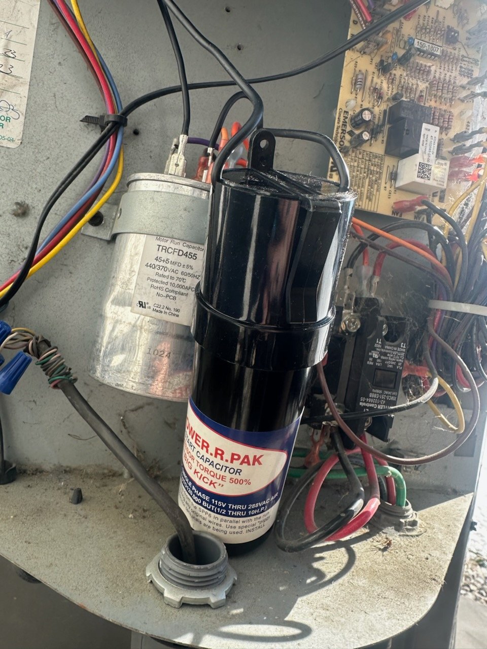 Electrical components inside an HVAC service compartment