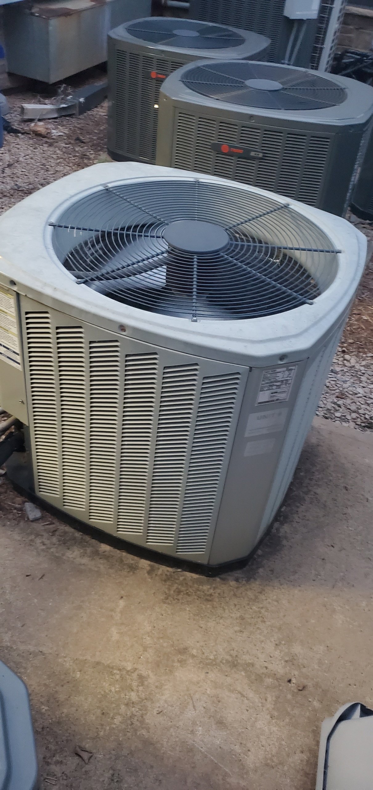 A row of outdoor HVAC condensing units