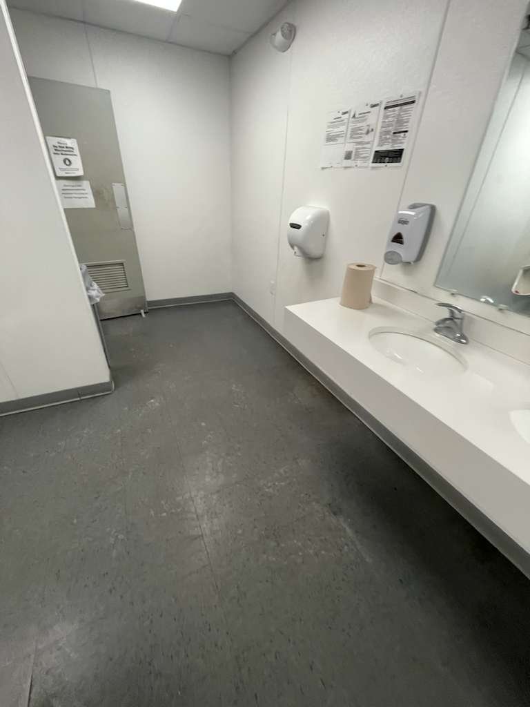 Commercial restroom with sinks and plumbing fixtures